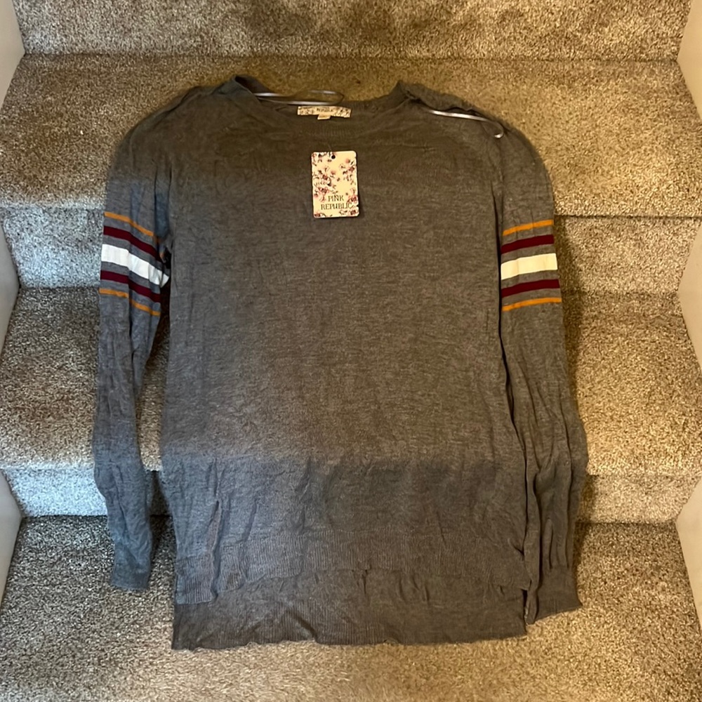 Gray sweater with striped arms